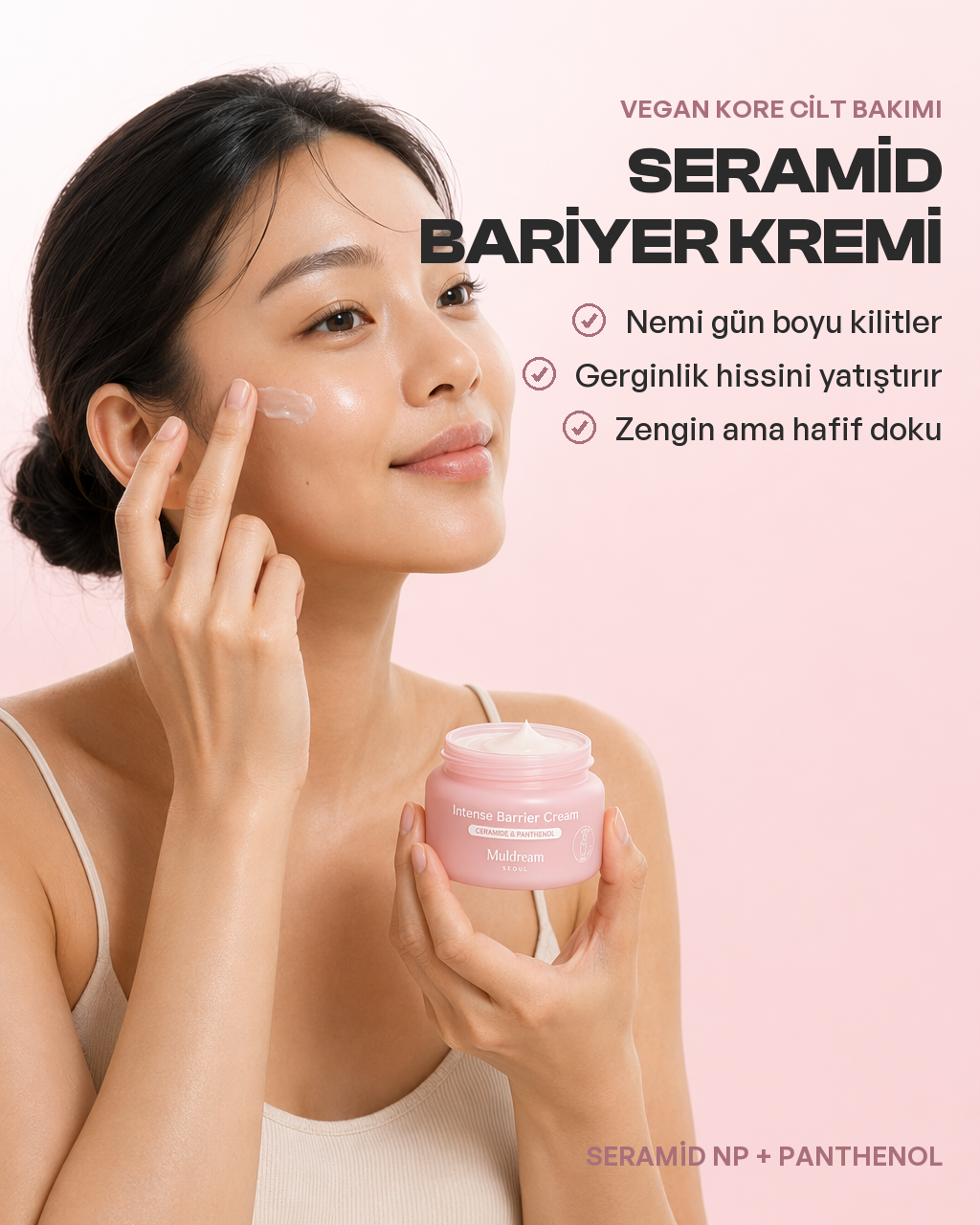 Parmak ucunda Intense Barrier Cream'in zengin krem dokusu yakın çekimde